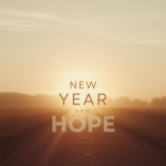 "New Year New Hope" text over a background of road lit with a warm sunrise.