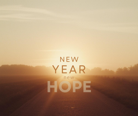 "New Year New Hope" text over a background of road lit with a warm sunrise.