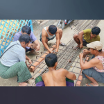 Men working, forming rebar for foundation construction