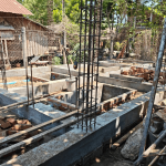Construction foundation with rebar and concrete footings for new Myanmar shelter building