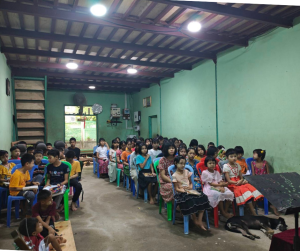 The family already at home in this shelter — and the reason every brick matters.