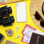 Travel items and a map in warm natural light representing auction travel package voting