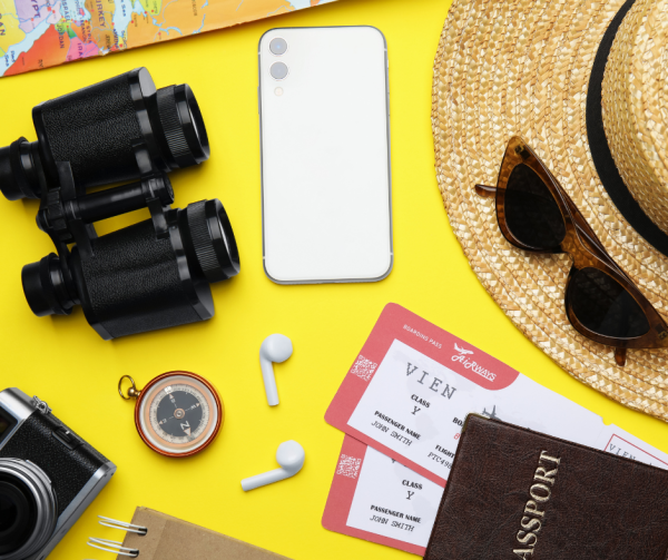 Travel items and a map in warm natural light representing auction travel package voting