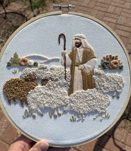 Hand embroidered good shepherd with sheep